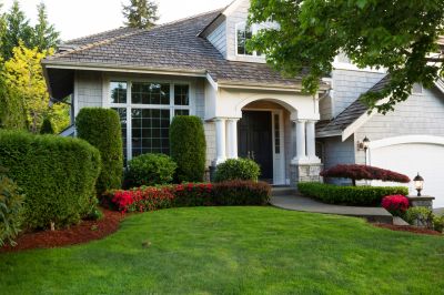 Home with Well-Maintained Shrubs